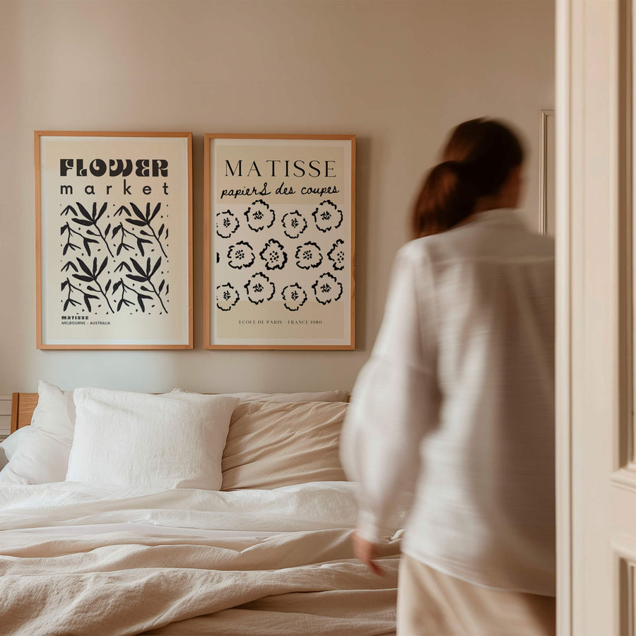 Matisse-inspired floral print featuring black abstract flowers on a neutral beige background. A modern and minimalist wall art piece perfect for contemporary interiors. Get 2PrintsFor$100 that comes with Free Shipping 🚚💫 in Australia.