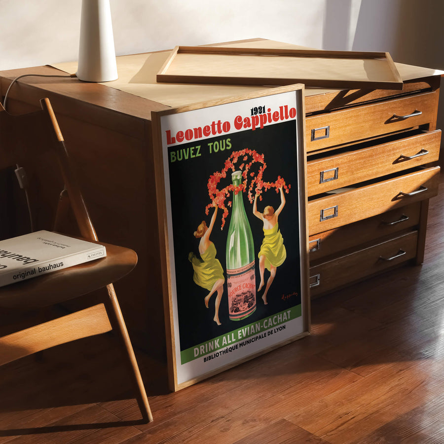 Evian Cachat print by Leonetto Cappiello in Art Nouveau style, featuring bold typography, vibrant green tones, and vintage advertising charm. Perfect for retro decor lovers.