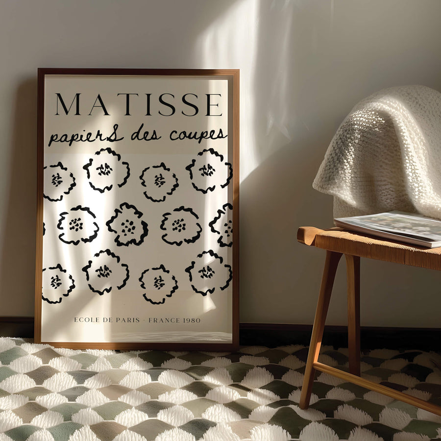 Matisse-inspired floral print featuring black abstract flowers on a neutral beige background. A modern and minimalist wall art piece perfect for contemporary interiors. Get 2PrintsFor$100 that comes with Free Shipping 🚚💫 in Australia.