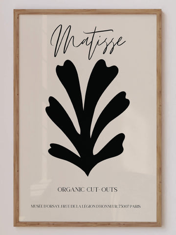 Matisse-inspired black organic cut-out print featuring bold abstract botanical shapes on a neutral background. A minimalist and modern wall art piece. Get 2PrintsFor$100 that comes with Free Shipping 🚚💫 in Australia.