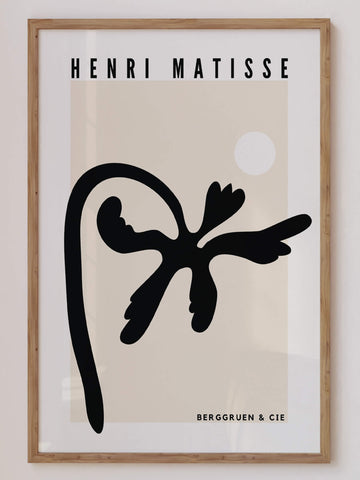 Matisse-inspired black palm abstract print featuring bold organic cut-out shapes against a neutral beige background. A modern and minimalist botanical wall art piece. Get 2PrintsFor$100 that comes with Free Shipping 🚚💫 in Australia.