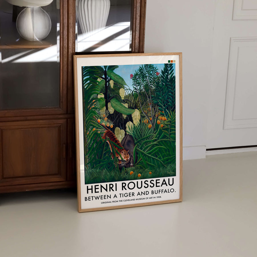 A captivating Henri Rousseau jungle print, depicting a tiger and buffalo hidden in lush tropical foliage. This vintage French masterpiece adds an exotic and dramatic touch to any space, perfect for maximalist decor lovers and art enthusiasts.